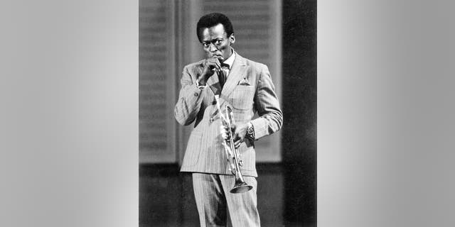 Jazz trumpeter and composer Miles Davis plays trumpet as he performs onstage in circa 1959 in West Germany. (Photo by Michael Ochs Archives/Getty Images)
