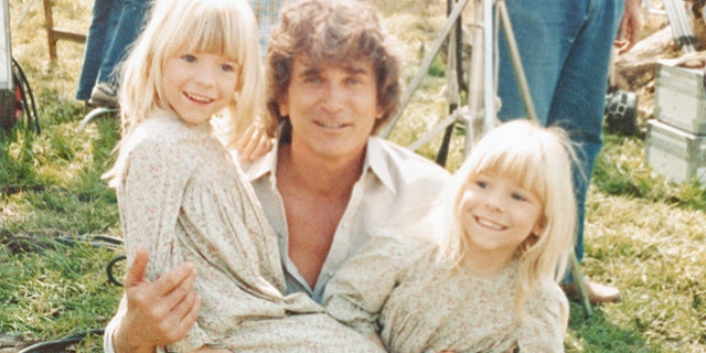 Michael Landon holding Wendi Lou Lee and her twin sister Brenda.