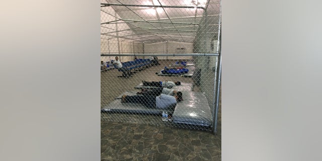 Migrants rest in the new migrant holding facility at the Tornillo Port of Entry in Texas. (Charlie Lapastora/Fox News)