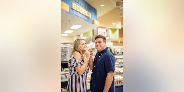 In the series of sweet pictures, the couple smooched behind a freezer door, rode a shopping cart and, of course, sampled Publix's legendary cookies.