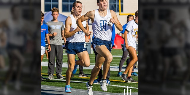 Twin brothers Joshua and Jacob Lowe running in high school. (Photo courtesy of Dave Lowe)
