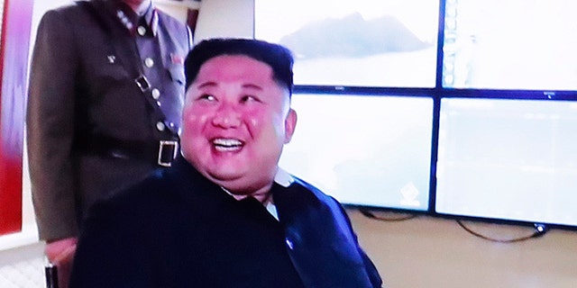 People watch a TV showing an image of North Korean leader Kim Jong Un during a news program at the Seoul Railway Station in Seoul, South Korea, Thursday, Aug. 1, 2019. North Korea said Thursday Kim supervised the first test firing of a new multiple rocket launcher system that could potentially enhance its ability to strike targets in South Korea and U.S. military bases there.