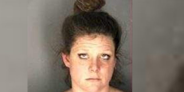Melody Mellon, 30, was arrested for allegedly stealing a man's dog while he was having a seizure, police said.