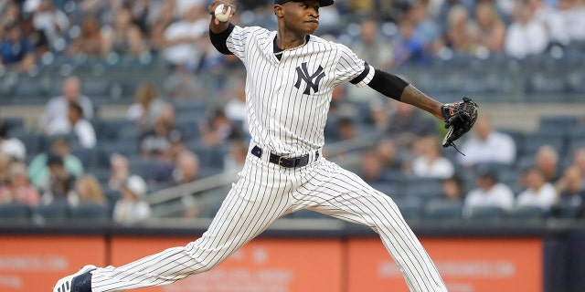 New York Yankees' Domingo German delivers a pitch during the first inning of the team's baseball game against the Baltimore Orioles on Tuesday, Aug. 13, 2019, in New York. (AP Photo/Frank Franklin II)