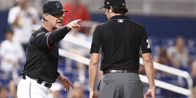 Miami Marlins manager Don Mattingly yells towards umpire John Tumpane after a balk call was made on Miami Marlins starting pitcher Caleb Smith during the fifth inning of the team's baseball game against the Atlanta Braves on Friday, Aug. 9, 2019, in Miami. Mattingly was thrown out of the game. (AP Photo/Brynn Anderson)