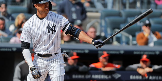 FILE - In this Saturday, March 30, 2019 file photo, New York Yankees right fielder Giancarlo Stanton waits for the pitch against the Baltimore Orioles during the fourth inning of a baseball game in New York.  (AP Photo/Julie Jacobson, File)