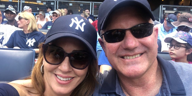 Marty Bailey, right, with his wife Sara Carter attending a game between the New York Yankees and Cleveland Indians.