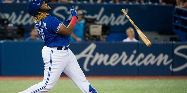 Toronto Blue Jays designated hitter Vladimir Guerrero Jr. reacts after hitting a pop flyout during ninth-inning baseball game action against the Tampa Bay Rays in Toronto, Sunday, July 28, 2019. (Nathan Denette/The Canadian Press via AP)