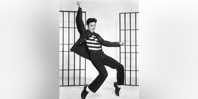 Elvis Presley on the set of "Jailhouse Rock," directed by Richard Thorpe. (Photo by Metro-Goldwyn-Mayer/Sunset Boulevard/Corbis via Getty Images)