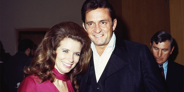 Married country singers Johnny Cash and June Carter Cash pose for a portrait at an event on September 1969 in California.