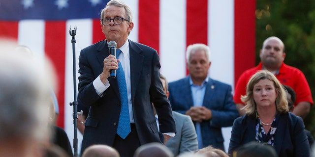Ohio Gov. Mike DeWine, left, speaks alongside Dayton Mayor Nan Whaley, right, during a vigil at the scene of a mass shooting, Sunday, Aug. 4, 2019, in Dayton, Ohio. (Associated Press)
