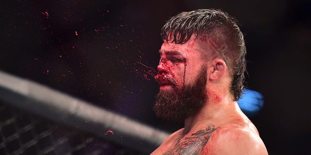 Blood is seen spraying off the face of Mike Perry as he reacts to his fight against Vicente Luque during UFC Fight Night at Antel Arena. Jason Silva-USA TODAY Sports
