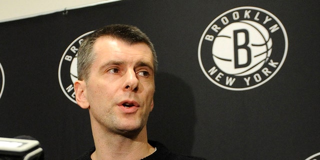 Brooklyn Nets principal owner Mikhail Prokhorov speaks to the media concerning the firing of head coach Avery Johnson. Prokhorov spoke at half time of an NBA basketball game against the Charlotte Bobcats on Friday, Dec., 28, 2012 at Barclays Center in New York. (AP Photo/Kathy Kmonicek)