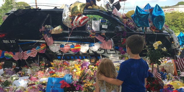 Officer Sheldon's police cruiser was decorated after his death.