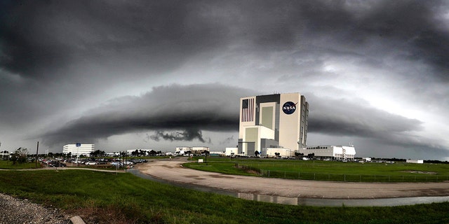 Thunderstorms flank the Kennedy Space Center's Vehicle Assembly building earlier this month.