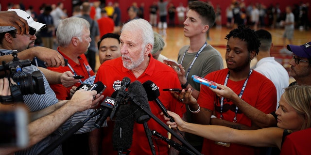 FILE - In this July 26, 2018, file photo, head coach head coach Gregg Popovich speaks with the media during a training camp for USA Basketball, in Las Vegas. USA Basketball opened training camp Monday, Aug. 5, 2019, for the FIBA World Cup, which starts Aug. 31 in China. (AP Photo/John Locher, File)