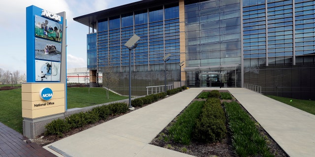 FILE - In this April 25, 2018, file photo, NCAA headquarters in Indianapolis is viewed. The NCAA has backtracked on its new agent certification standards and will no longer require a bachelor's degree for those who will be permitted to represent a student-athlete. (AP Photo/Darron Cummings, File)