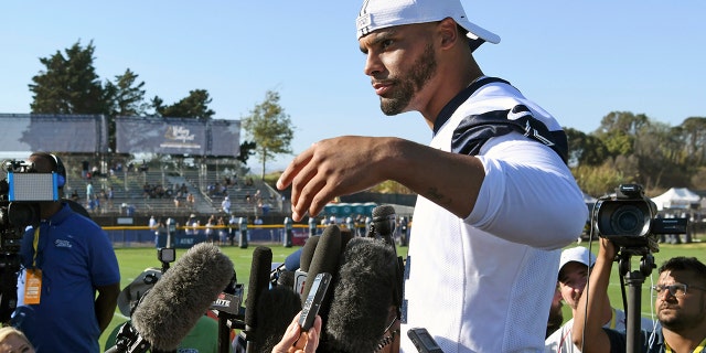 Dak Prescott pretends he can’t hear the question when the subject turns to a new contract for the star quarterback of the Dallas Cowboys, while receiver Amari Cooper steadfastly says he simply doesn’t think about what might be happening in his negotiations. Both reported to training camp on time as they prepare for the final year of their respective deals. (AP Photo/Michael Owen Baker, File)