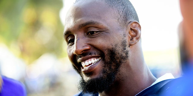Dallas Cowboys defensive end Robert Quinn talks with reporters at the NFL football team's training camp in Oxnard, Calif., Monday, July 29, 2019. (AP Photo/Michael Owen Baker)