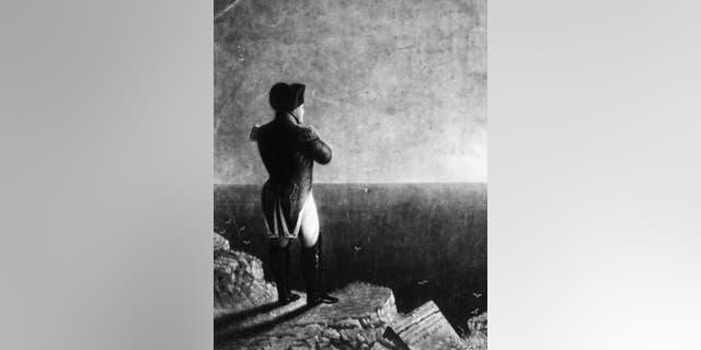 Napoleon I (1769 - 1821) looking out to sea on the island of St Helena, where he was exiled from 1815 to his death. Original Artwork: Engraving by JE Coombe after a painting by BR Haydon.
