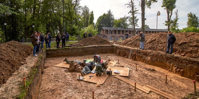 Archaeologists work on July 7, 2019 at a site of the burial place of French General Charles Etienne Gudin de la Sablonniere.