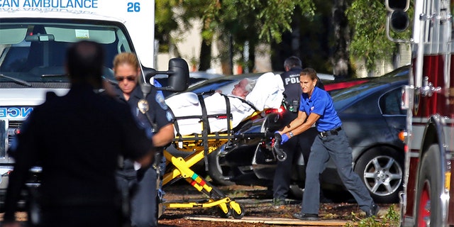 Ambulance attendants carrying a woman from the Hollywood Hills Rehabilitation Center after a loss of air conditioning due to Hurricane Irma in Hollywood, Florida in September 2017.