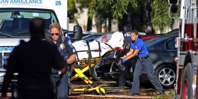 Ambulance attendants carrying a woman from the Hollywood Hills Rehabilitation Center after a loss of air conditioning due to Hurricane Irma in Hollywood, Florida in September 2017. 