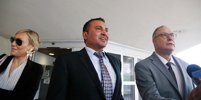 Lawyers for the accused, Lawrence Hashish, center, David Frankel, right, and paralegal Juliana Marulanda, at Broward County Jail on Monday.