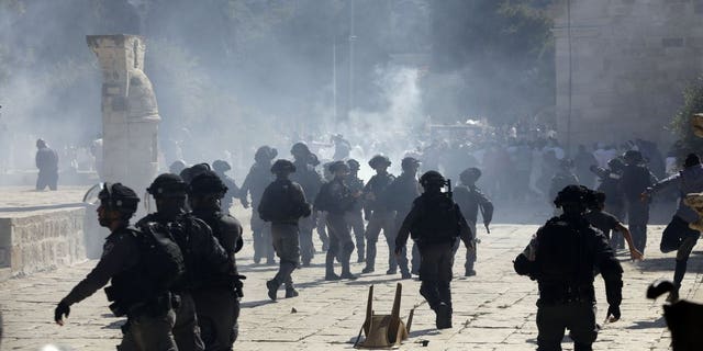 Riots outside Jerusalem holy site injure several people including ...