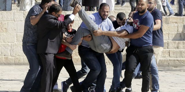 Islamic Jihad and the militant group Hamas threatened increased violence on Sunday after a day of riots at a major Jerusalem holy site left at least four Israeli police officers and several Muslim and Jewish people injured, according to reports.