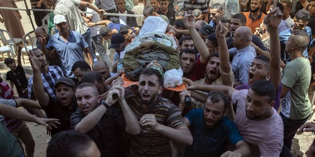 Protesters threw stones at police and chanted “Allahu Akbar” and police reportedly retaliated by charging into the compound while firing stun grenades and rubber-coated bullets.