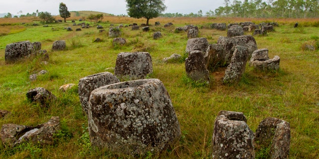 The Plain of Jars, seen in this undated file photo, consists of thousands of stone jars scattered around the upland valleys and the lower foothills of the central plain of the Xiangkhoang Plateau in Laos and is dated to the Iron Age (500 BC to AD 500). It is one of the most important prehistoric sites in Southeast Asia. (Photo by: Avalon/Universal Images Group via Getty Images)