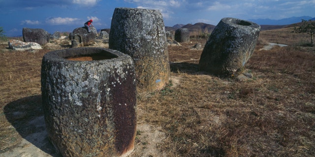Jars in sandstone in the archaeological site of the Plain of Jars, plateau of Xiang Khoang, Laos.