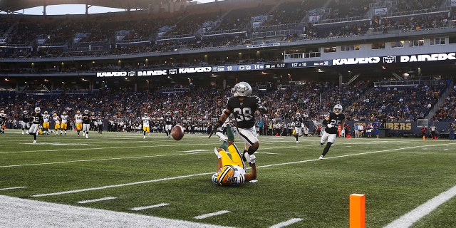 Green Bay Packers' Equanimeous St. Brown (19) misses the pass in the modified end zone as Oakland Raiders' Keisean Nixon (38) defends during the first half of an NFL preseason football game Thursday, Aug. 22, 2019, in Winnipeg, Manitoba. (Associated Press)