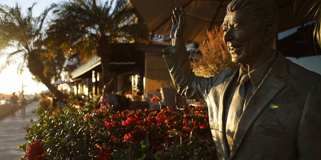A statue of former President Ronald Reagan in front of a home on Orange County's Balboa Island in Newport Beach, California, in 2018. (Mario Tama/Getty Images, File)