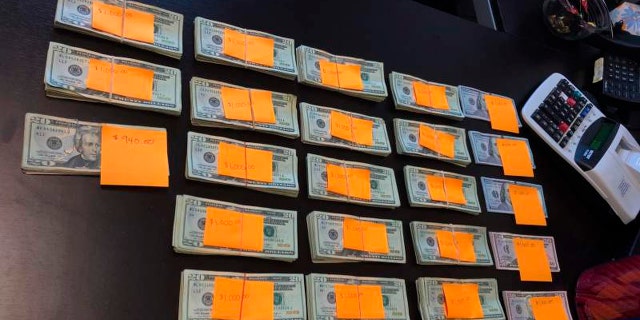 This Friday, Aug. 2, 2019, photo provided by Recology, shows nearly $23,000 in cash discarded at a recycling bin in a shoebox, which was recovered by a worker at the Samoa Resource Recovery Center operated by Recology in Samoa, Calif.