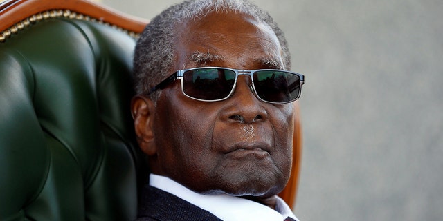Zimbabwe's former president Robert Mugabe looks on during a press conference at his private residence nicknamed "Blue Roof" in Harare, Zimbabwe, July 29, 2018.