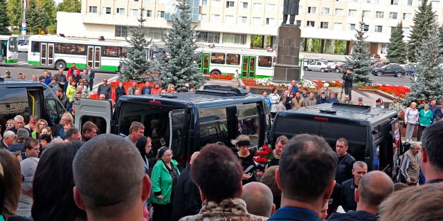 In this grab taken from a footage provided by the Russian State Atomic Energy Corporation ROSATOM press service, people gather for the funerals of five Russian nuclear engineers killed by a rocket explosion in Sarov.