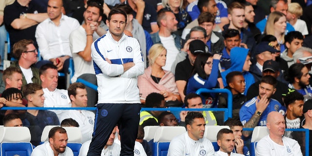 Chelsea's head coach Frank Lampard stands by the bench after Leicester tied the game 1-1 during the English Premier League soccer match between Chelsea and Leicester City at Stamford Bridge stadium in London, Sunday, Aug. 18, 2019. (AP Photo/Frank Augstein)