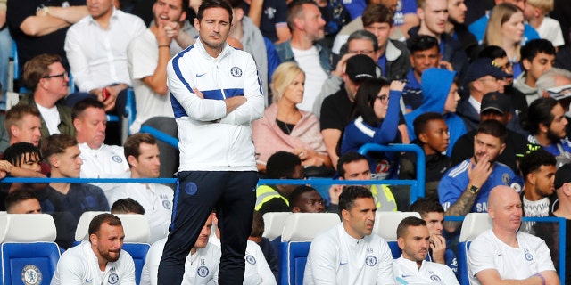 Chelsea's head coach Frank Lampard stands by the bench after Leicester tied the game 1-1 during the English Premier League soccer match between Chelsea and Leicester City at Stamford Bridge stadium in London, Sunday, Aug. 18, 2019. (AP Photo/Frank Augstein)