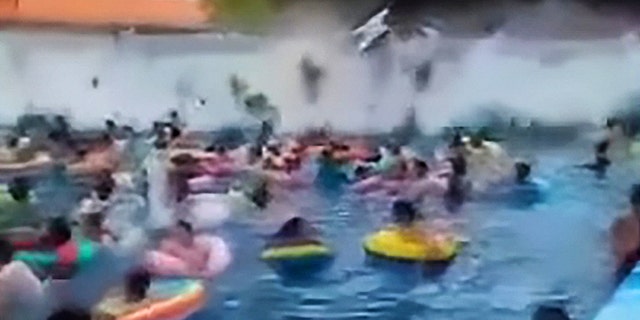 This viral video seen over two million times shows dozens of wave pool swimmers being swept away by a giant 10-foot ‘tsunami’ created by a faulty wave machine.