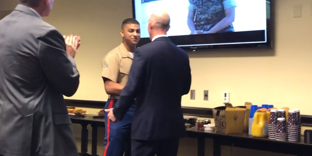 Marine Cpl. Stewart Rembert and FBI agent Robert Sowers at Sowers' retirement Friday in Knoxville, Tenn.