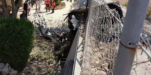 Stepping into the fence after the crash near Inca in Palma de Mallorca, Spain, on Sunday.