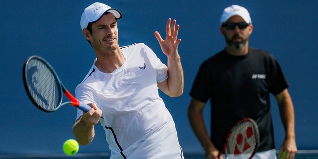 Andy Murray, left, of Britain, practices as his coach Jamie Delgado, right, at the Western & Southern Open tennis tournament, Sunday, Sunday, Aug. 11, 2019, in Mason, Ohio.