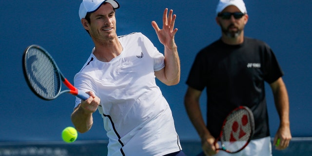Andy Murray, left, of Britain, practices as his coach Jamie Delgado, right, at the Western & Southern Open tennis tournament, Sunday, Sunday, Aug. 11, 2019, in Mason, Ohio. (AP Photo/John Minchillo)