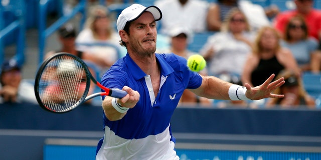 Andy Murray, of Britain, returns a shot against Richard Gasquet, of France, during first-round play at the Western & Southern Open tennis tournament Monday, Aug. 12, 2019, in Mason, Ohio. (AP Photo/Gary Landers)