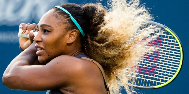 Serena Williams, of the United States, watches a return to Ekaterina Alexandrova, of Russia, during the Rogers Cup women’s tennis tournament Thursday, Aug. 8, 2019, in Toronto. (Nathan Denette/The Canadian Press via AP)