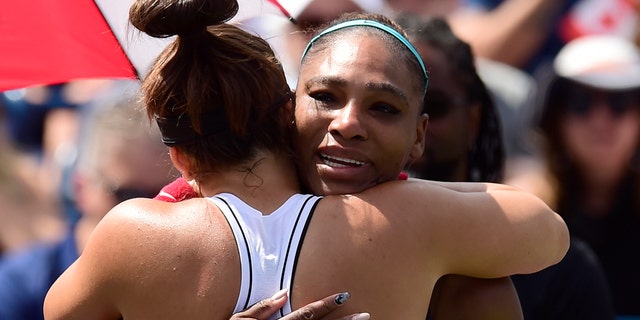 Canada's Bianca Andreescu, left, consoles Serena Williams, of the United States, after Williams had to retire from the final of the Rogers Cup tennis tournament in Toronto, Sunday, Aug. 11, 2019. (Frank Gunn/The Canadian Press via AP)
