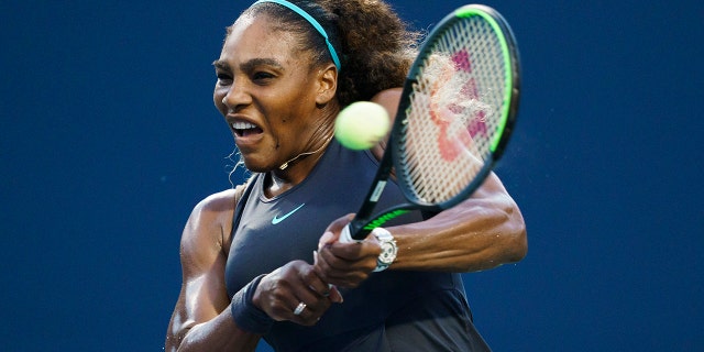 Serena Williams, of the United States, returns a shot to Elise Mertens, of Belgium, during the Rogers Cup women’s tennis tournament Wednesday, Aug. 7, 2019, in Toronto. (Mark Blinch/The Canadian Press via AP)