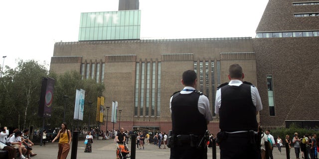 Emergency crews attending a scene at the Tate Modern art gallery, London, Sunday, Aug. 4, 2019.